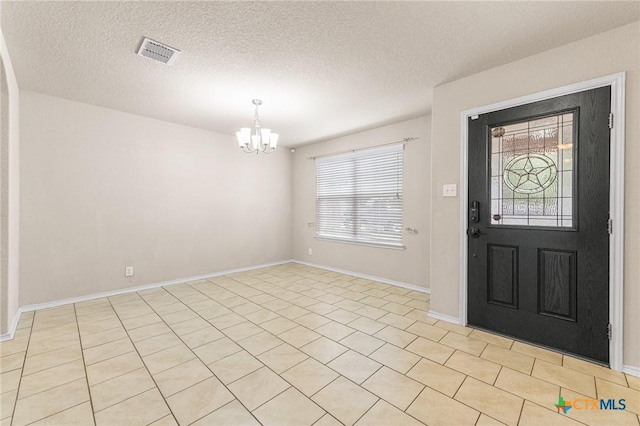 10055 Strasbourg Way, Schertz, TX 78154 - entrance foyer with a chandelier, plenty of natural light, and a textured ceiling