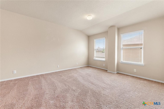 10055 Strasbourg Way, Schertz, TX 78154 - carpeted spare room with baseboards and vaulted ceiling