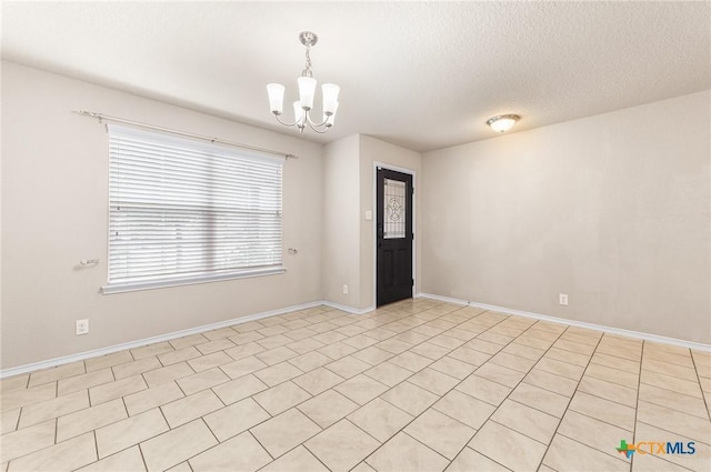 10055 Strasbourg Way, Schertz, TX 78154 - unfurnished room with a chandelier and a textured ceiling