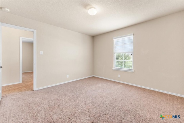 10055 Strasbourg Way, Schertz, TX 78154 - carpeted spare room featuring baseboards and a textured ceiling
