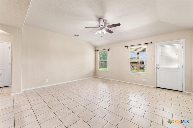 10055 Strasbourg Way, Schertz, TX 78154 - unfurnished room with ceiling fan, a textured ceiling, arched walkways, and light tile patterned floors