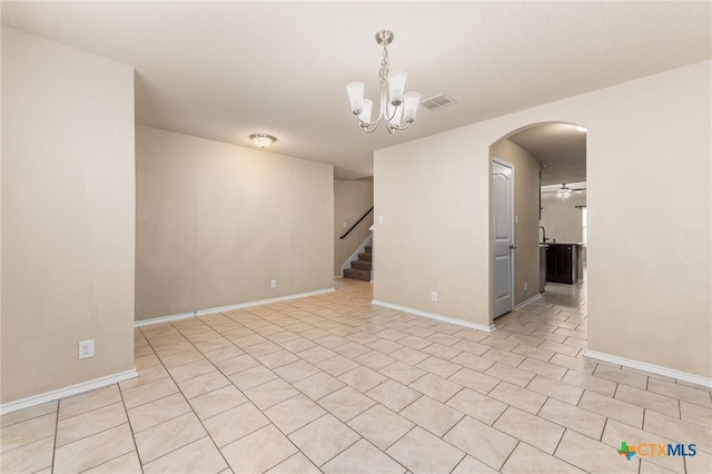 10055 Strasbourg Way, Schertz, TX 78154 - empty room with a chandelier, arched walkways, stairway, a ceiling fan, and light tile patterned flooring