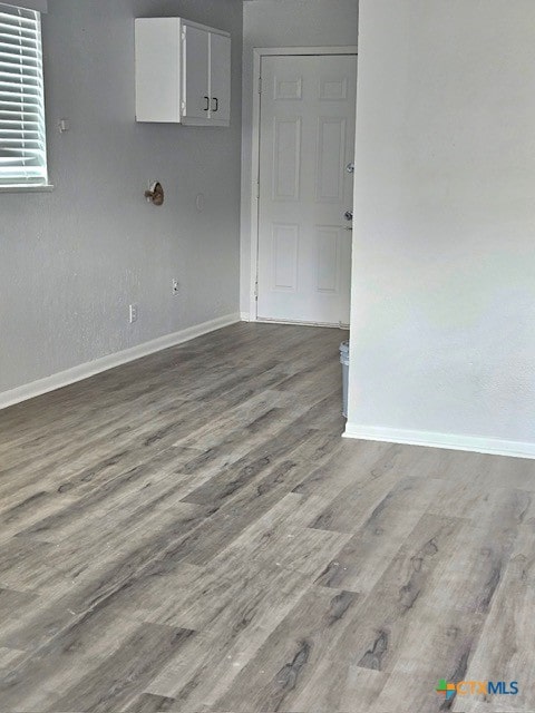 spare room with hardwood / wood-style flooring