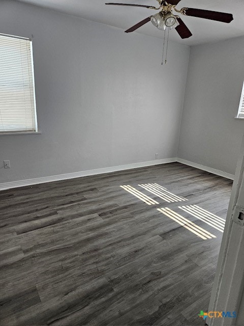 empty room featuring dark hardwood / wood-style floors and ceiling fan