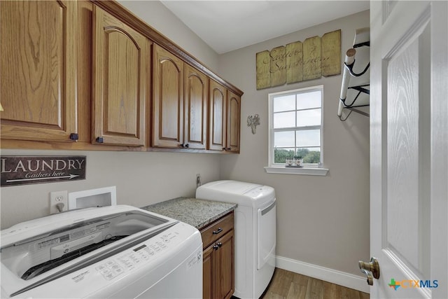 448 Summer Glen Ln, New Braunfels, TX 78132 - laundry room featuring cabinet space, baseboards, wood finished floors, and separate washer and dryer