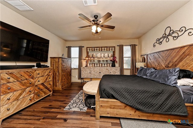 bedroom with dark wood-type flooring and ceiling fan