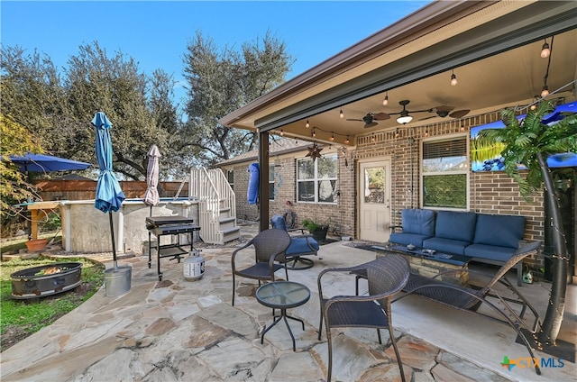 view of patio / terrace featuring ceiling fan and an outdoor living space