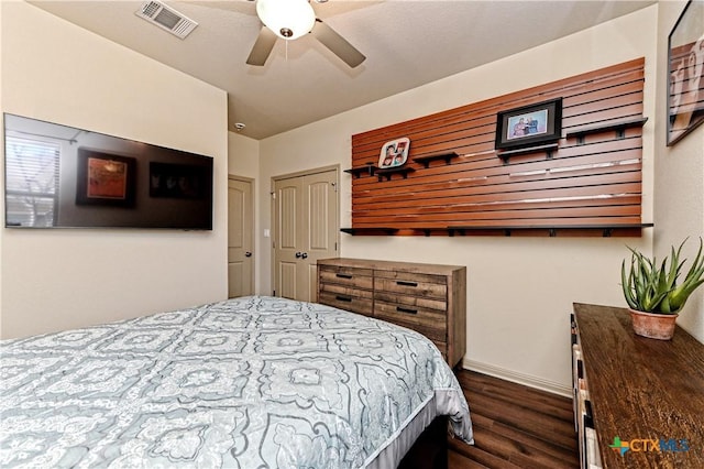 bedroom featuring ceiling fan and dark hardwood / wood-style flooring