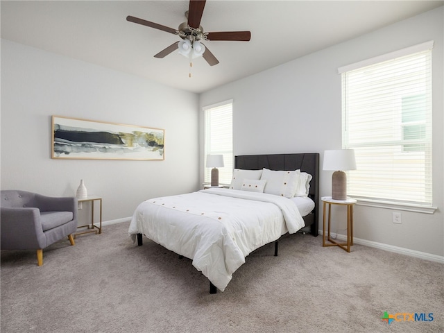 bedroom with carpet floors, baseboards, and a ceiling fan