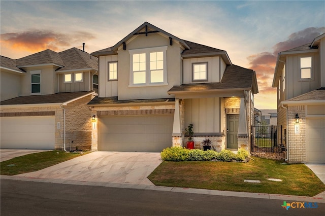 view of front of property featuring stucco siding, concrete driveway, an attached garage, board and batten siding, and stone siding