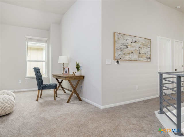 home office with high vaulted ceiling, carpet, and baseboards