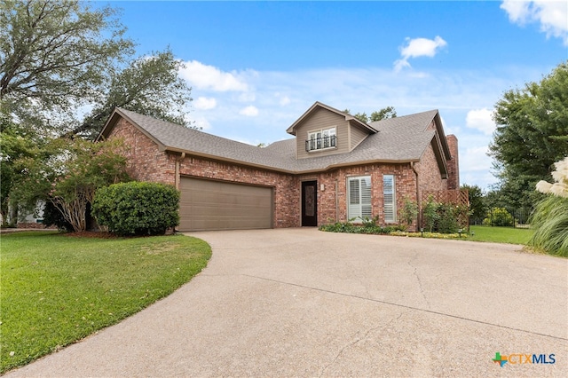 front of property with a garage and a front lawn