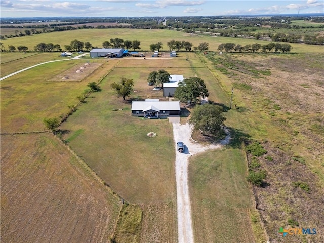 birds eye view of property featuring a rural view