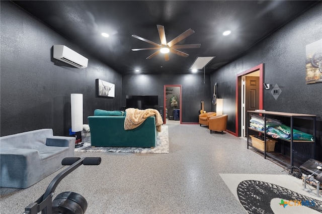 cinema room featuring a wall mounted air conditioner and ceiling fan