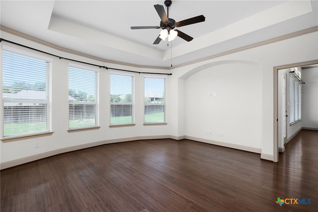8235 Shining Elk, Garden Ridge, TX 78266 - empty room with a tray ceiling, a ceiling fan, and dark wood-style flooring