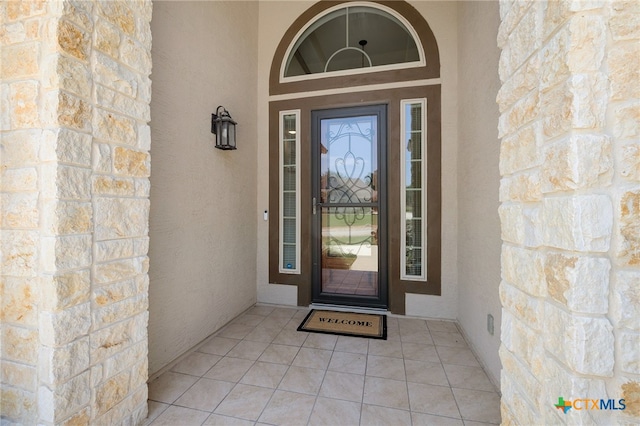 8235 Shining Elk, Garden Ridge, TX 78266 - view of exterior entry featuring stucco siding and stone siding