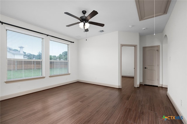 8235 Shining Elk, Garden Ridge, TX 78266 - empty room featuring attic access, dark wood-style floors, a ceiling fan, and arched walkways