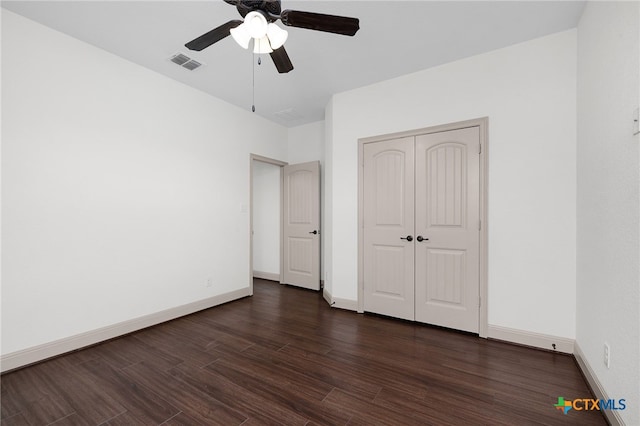 8235 Shining Elk, Garden Ridge, TX 78266 - unfurnished bedroom with dark wood-style floors, a closet, and a ceiling fan