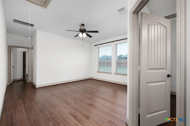 8235 Shining Elk, Garden Ridge, TX 78266 - unfurnished room featuring attic access, dark wood finished floors, and ceiling fan