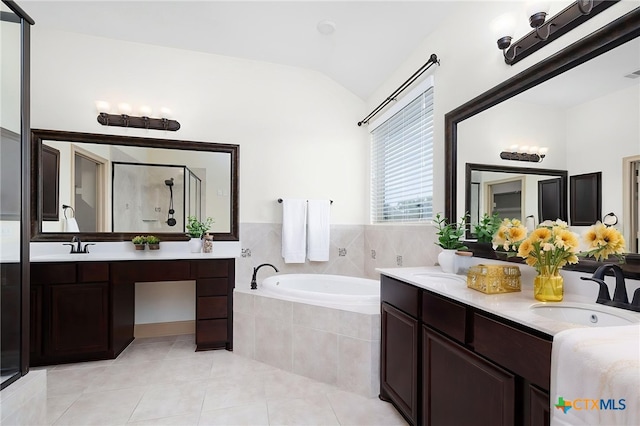 8235 Shining Elk, Garden Ridge, TX 78266 - bathroom with vaulted ceiling, a shower stall, a bath, double vanity, and tile patterned floors