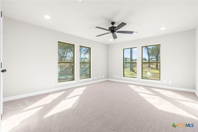 unfurnished room with carpet floors and ceiling fan