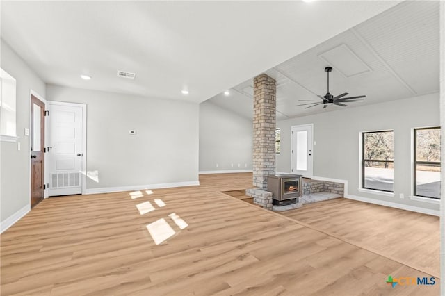 unfurnished living room with ceiling fan, ornate columns, and light wood-type flooring