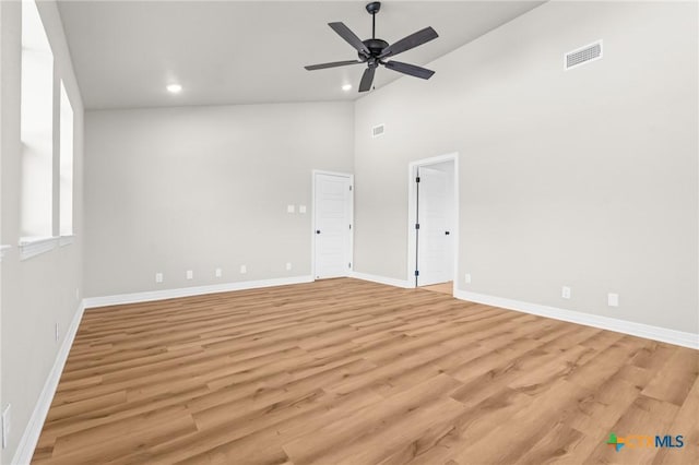 unfurnished room featuring ceiling fan, light hardwood / wood-style floors, and high vaulted ceiling