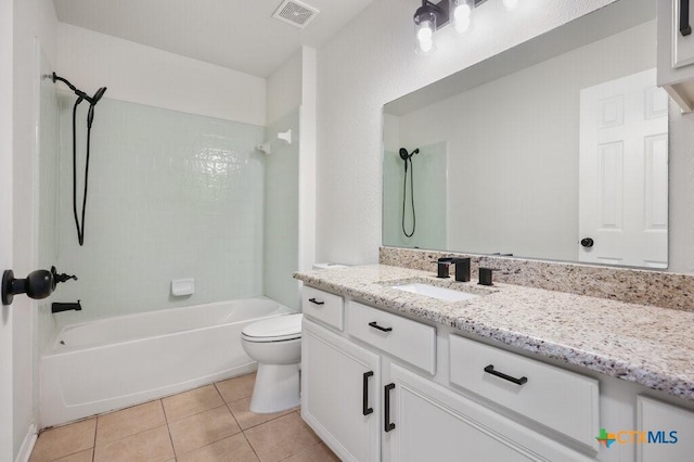 full bathroom featuring toilet, tiled shower / bath combo, tile patterned floors, and vanity