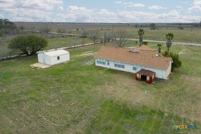 birds eye view of property with a rural view