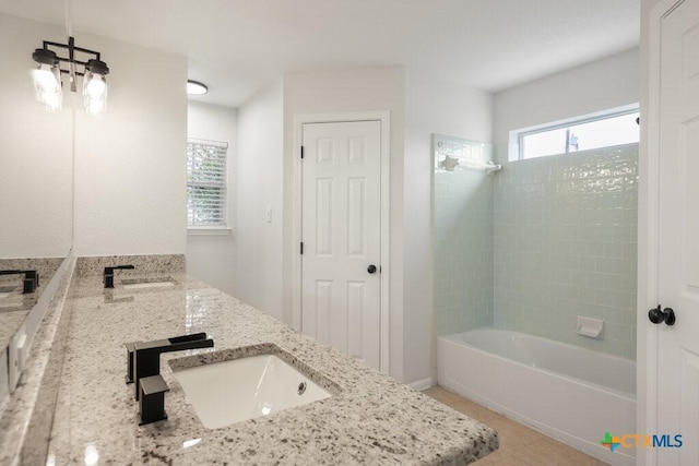 bathroom featuring shower with separate bathtub, tile patterned floors, and vanity