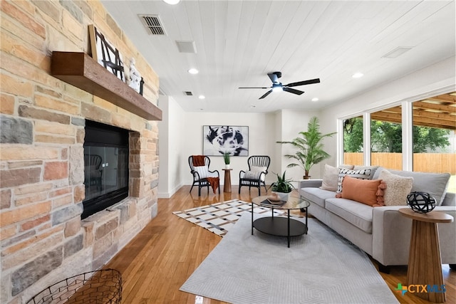 456 Magazine Ave, New Braunfels, TX 78130 - living room with hardwood / wood-style flooring, a fireplace, recessed lighting, and a ceiling fan