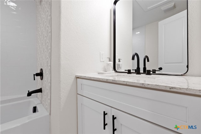 456 Magazine Ave, New Braunfels, TX 78130 - full bathroom with vanity, a textured wall, and shower / washtub combination