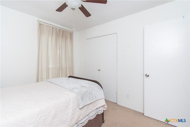 2210 Buckskin Trl, Temple, TX 76502 - bedroom featuring light colored carpet, a closet, and ceiling fan