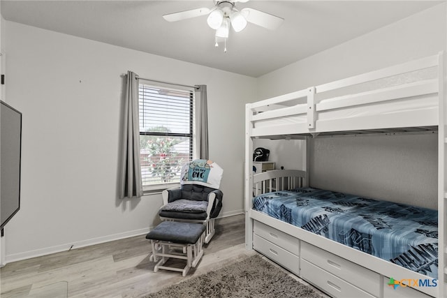 bedroom featuring light hardwood / wood-style floors and ceiling fan