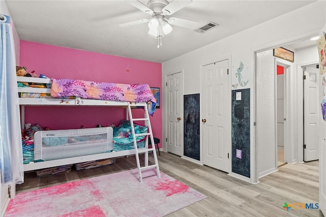 bedroom featuring wood-type flooring and ceiling fan