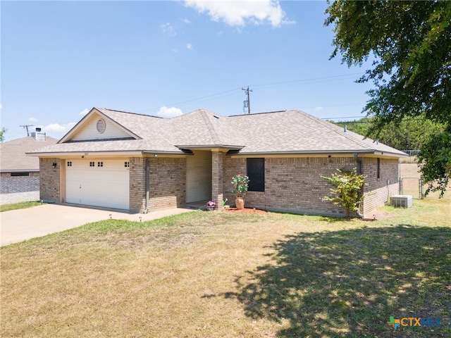 single story home featuring central AC unit, a garage, and a front yard