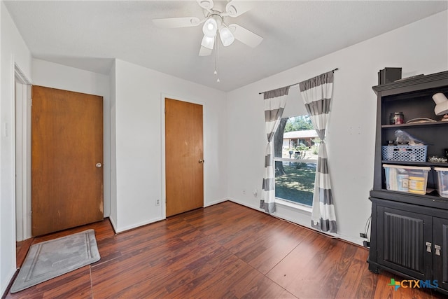 bedroom featuring dark hardwood / wood-style floors and ceiling fan