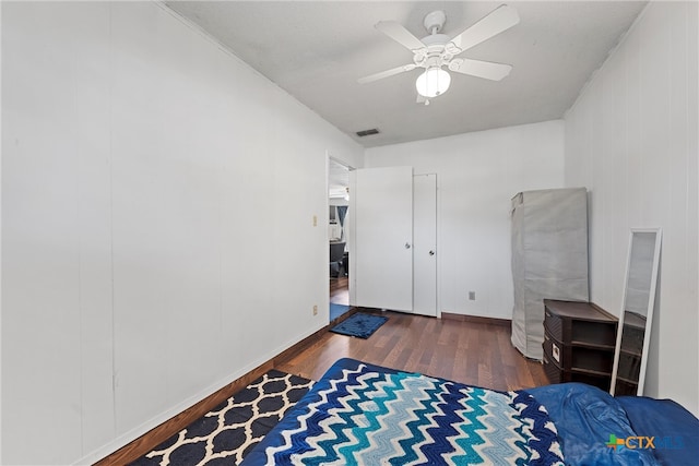 bedroom featuring ceiling fan and dark hardwood / wood-style floors