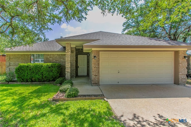 21 Artesian Dr, Belton, TX 76513 - single story home with an attached garage, driveway, a front yard, and roof with shingles