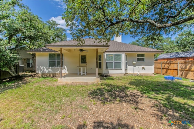 21 Artesian Dr, Belton, TX 76513 - back of house with ceiling fan, a chimney, and roof with shingles