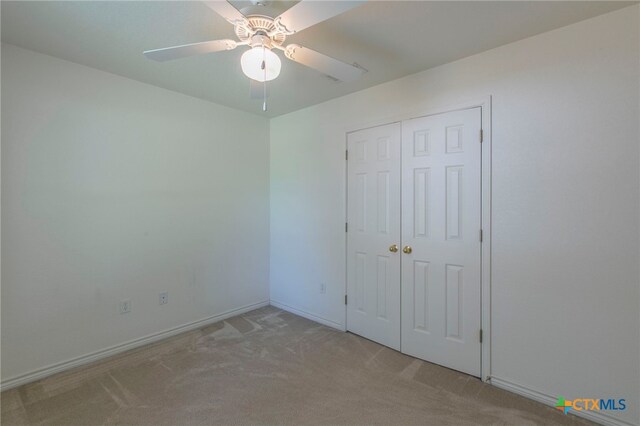 21 Artesian Dr, Belton, TX 76513 - unfurnished bedroom featuring carpet, a closet, and a ceiling fan