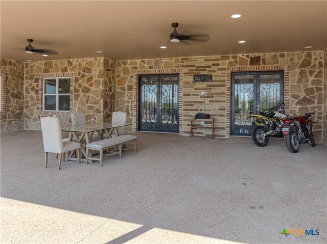 view of patio featuring ceiling fan