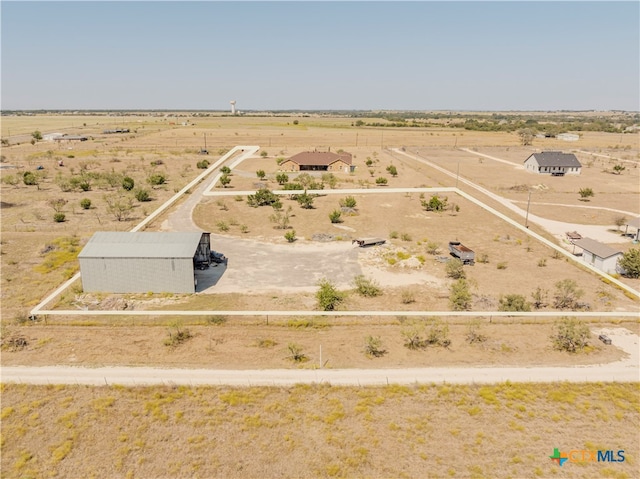 birds eye view of property featuring a rural view