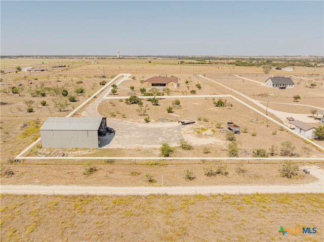 birds eye view of property featuring a rural view