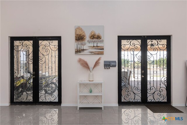 entryway featuring french doors