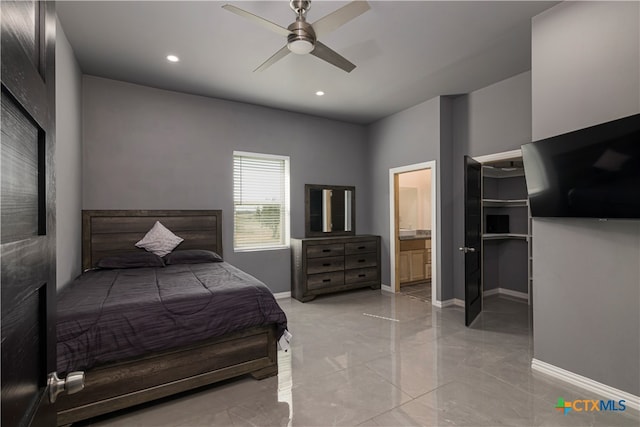 bedroom featuring ensuite bathroom and ceiling fan