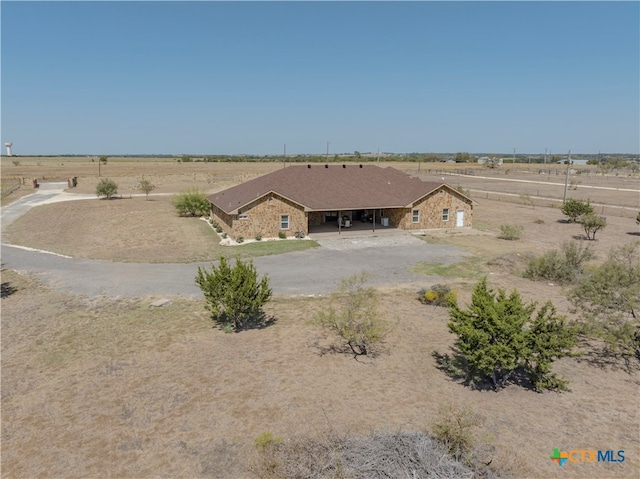 birds eye view of property with a rural view