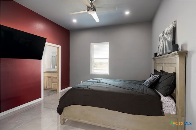 bedroom with ensuite bath and ceiling fan