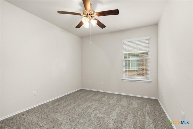 carpeted empty room with ceiling fan