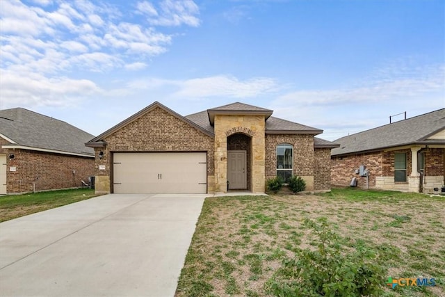 view of front of house with a front lawn and a garage